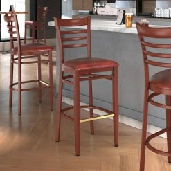 Cheap 🛒 LT&S Spartan Series Lancaster Table & Seating Spartan Series Bar Height Metal Ladder Back Chair With Mahogany Wood Grain Finish And Burgundy Vinyl Seat 🌟