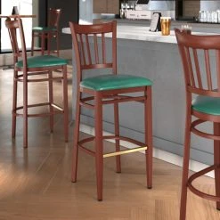 New 🥰 LT&S Spartan Series Lancaster Table & Seating Spartan Series Bar Height Metal Slat Back Chair With Mahogany Wood Grain Finish And Green Vinyl Seat 😀
