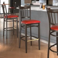 Outlet 🥰 LT&S Spartan Series Lancaster Table & Seating Spartan Series Bar Height Metal Slat Back Chair With Walnut Wood Grain Finish And Red Vinyl Seat ⭐