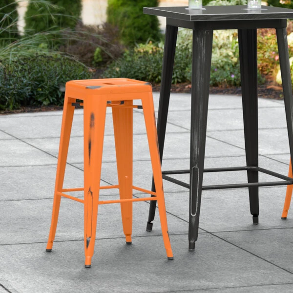 Budget 🔔 LT&S Alloy Series Lancaster Table & Seating Alloy Series Distressed Orange Stackable Metal Indoor / Outdoor Industrial Barstool With Drain Hole Seat ⌛