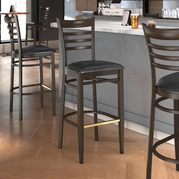 Deals 🤩 LT&S Spartan Series Lancaster Table & Seating Spartan Series Bar Height Metal Ladder Back Chair With Walnut Wood Grain Finish And Black Vinyl Seat ⌛