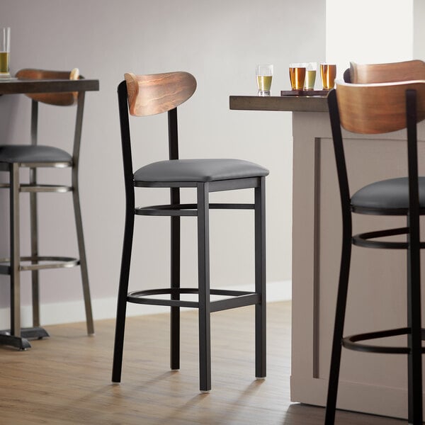 Lancaster Table & Seating Boomerang Bar Height Black Chair with Dark Gray Vinyl Seat and Vintage Wood Back Best Pirce ⌛ LT&S Boomerang Series Lancaster Table & Seating Boomerang Bar Height Black Chair With Dark Gray Vinyl Seat And Vintage Wood Back ✔️ -Lancaster Shop unnamed file 2316