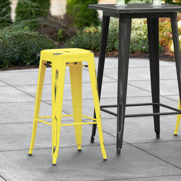 Wholesale ???? LT&S Alloy Series Lancaster Table & Seating Alloy Series Distressed Yellow Stackable Metal Indoor / Outdoor Industrial Barstool With Drain Hole Seat ???? 3 Wholesale ???? LT&S Alloy Series Lancaster Table & Seating Alloy Series Distressed Yellow Stackable Metal Indoor / Outdoor Industrial Barstool With Drain Hole Seat ????